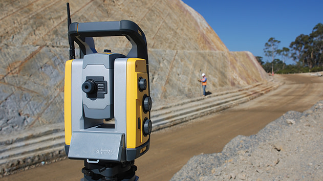 Trimble SPS930 universal total station gathering survey data on a roading project