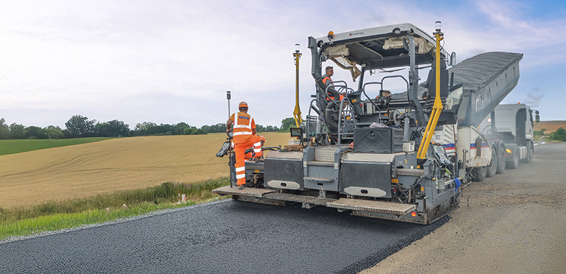 Paving machine with Trimble Roadworks laying new asphalt
