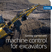 Compact excavator in a field using trimble earthworks