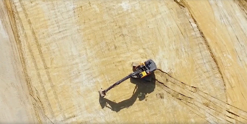 Excavator in a dirt field