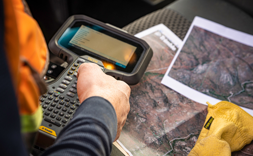 Surveyor sharing information from field to office.
