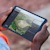 Construction worker on site using a tablet with Trimble Site Management software for field to office connectivity