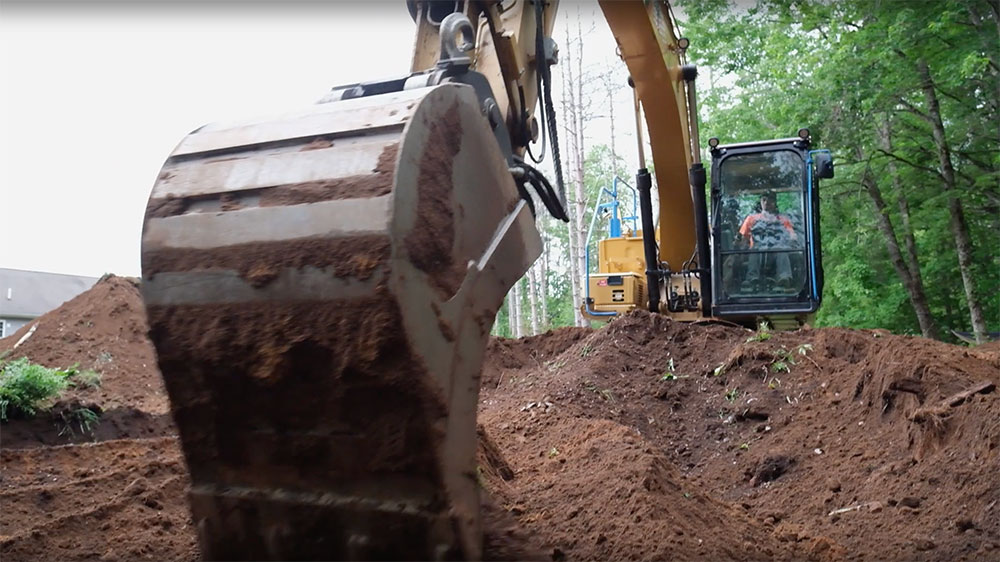 Excavator digging a large hole