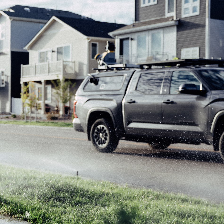 Trimble MX60 mobile mapping system mounted to a truck driving through neighborhood