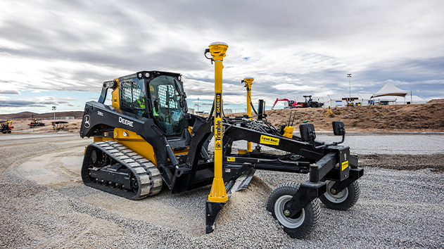 Compact track loader moving dirt using the Trimble Earthworks Grade Control system