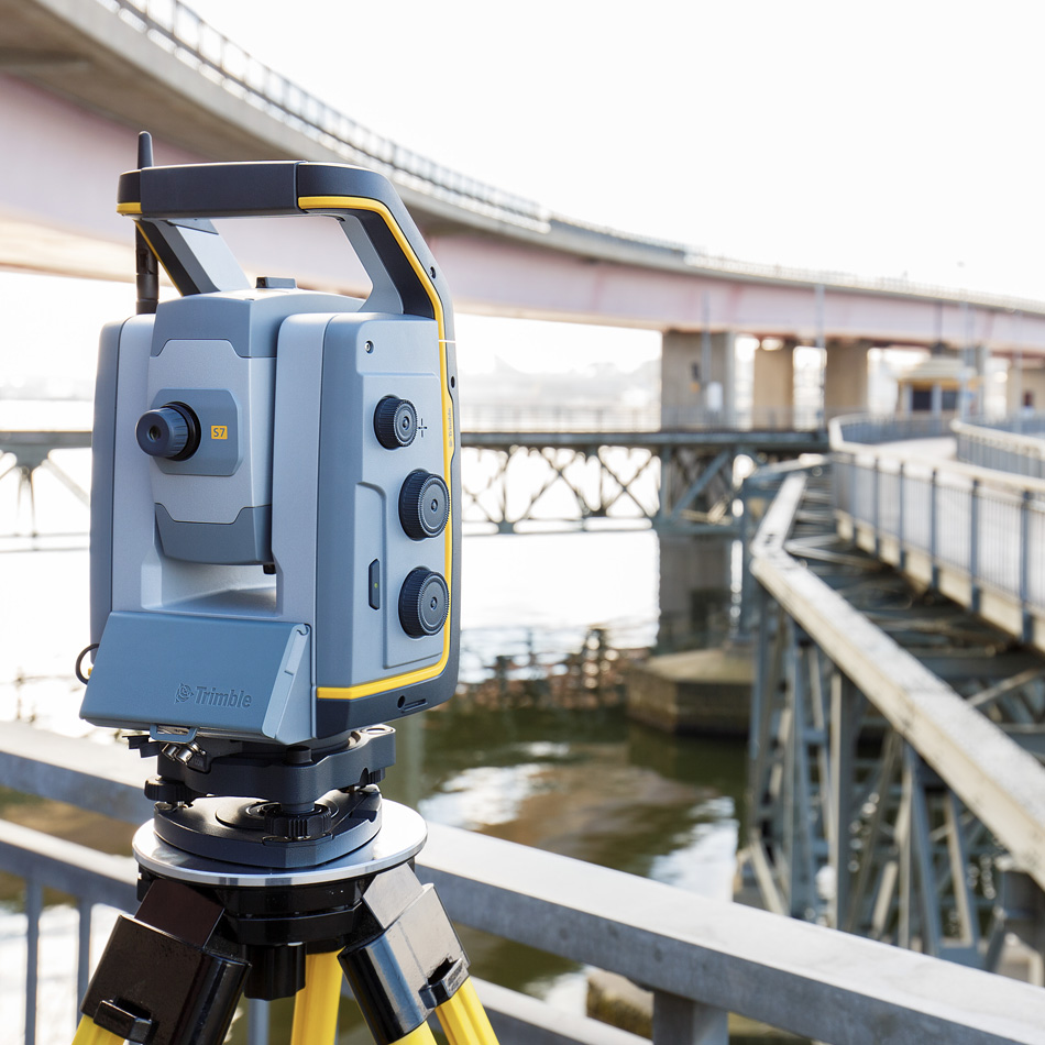 Trimble S7 total station mounted near a highway overpass