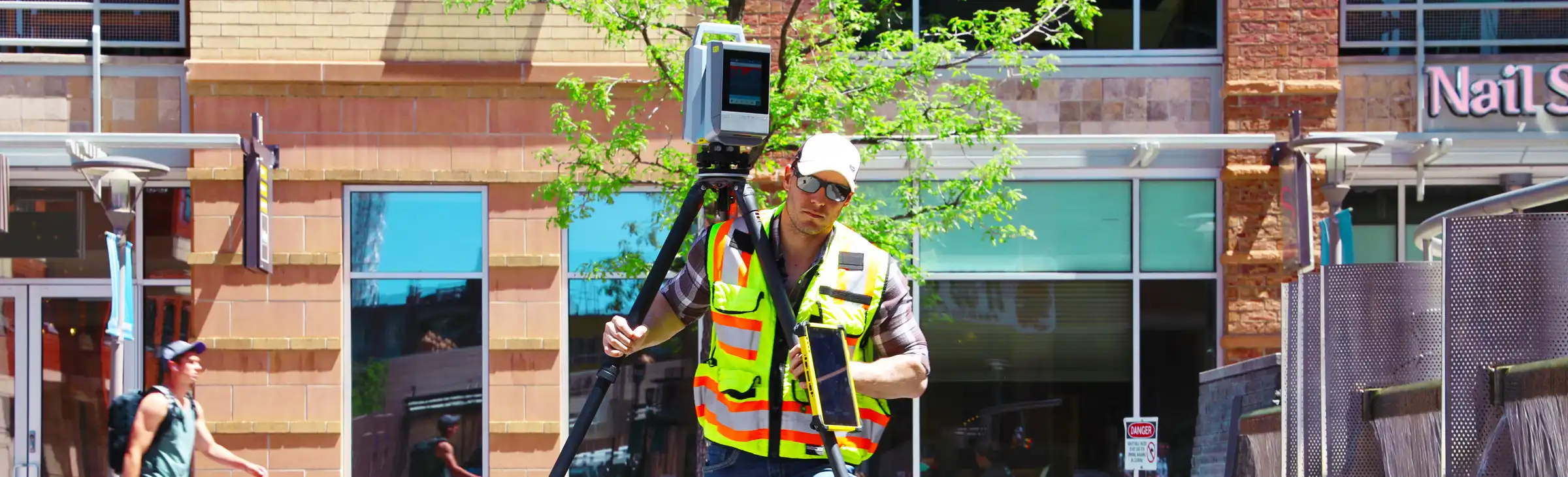 man with x12 outside an office building