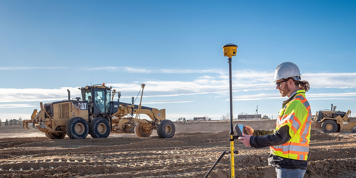 Contractors surveying and preparing a work site using the Trimble Siteworks Positioning System