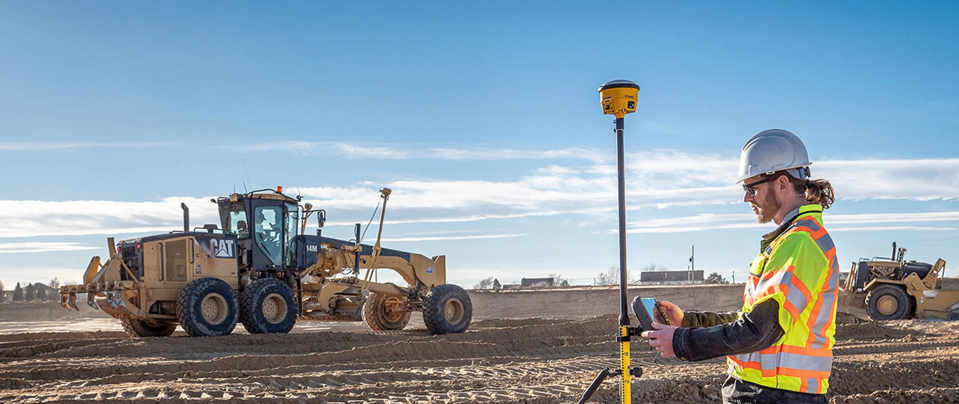 Contractors surveying and preparing a work site using the Trimble Siteworks Positioning System