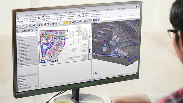 Desktop monitor displaying Trimble Business Center software digitizing plan sets from PDF into 3D linework and models