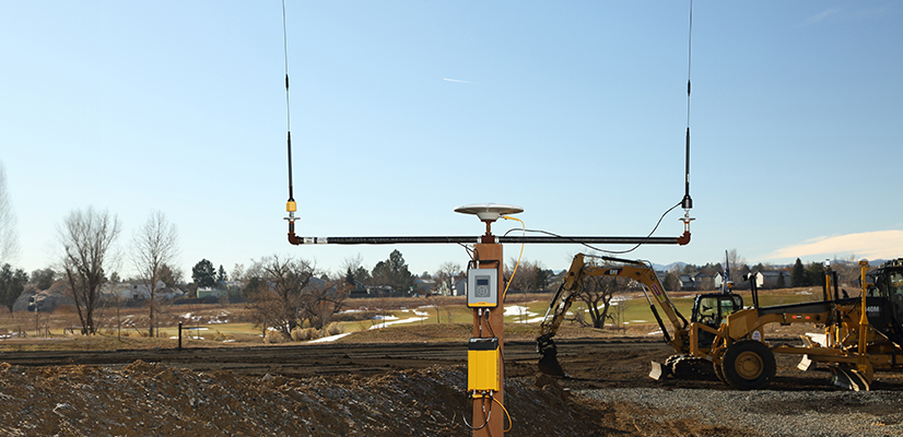 Trimble TDL450B Radio and R750 GNSS Modular receiver with construction site in the background