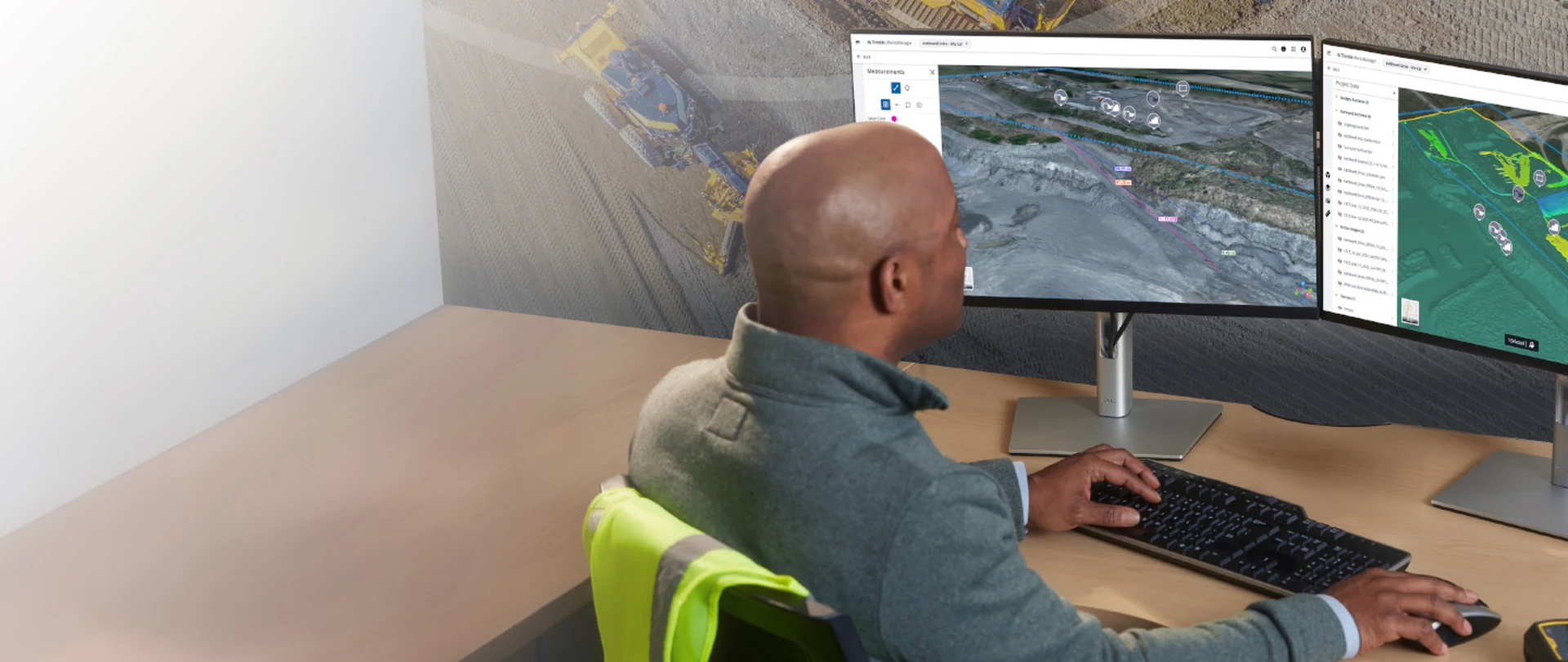 Construction worker on site using Trimble Site Management software for field to office connectivity