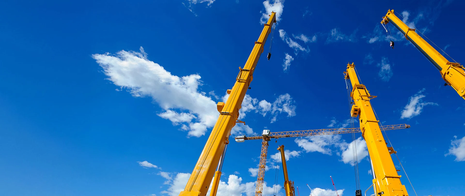 A group of several crane masts and towers