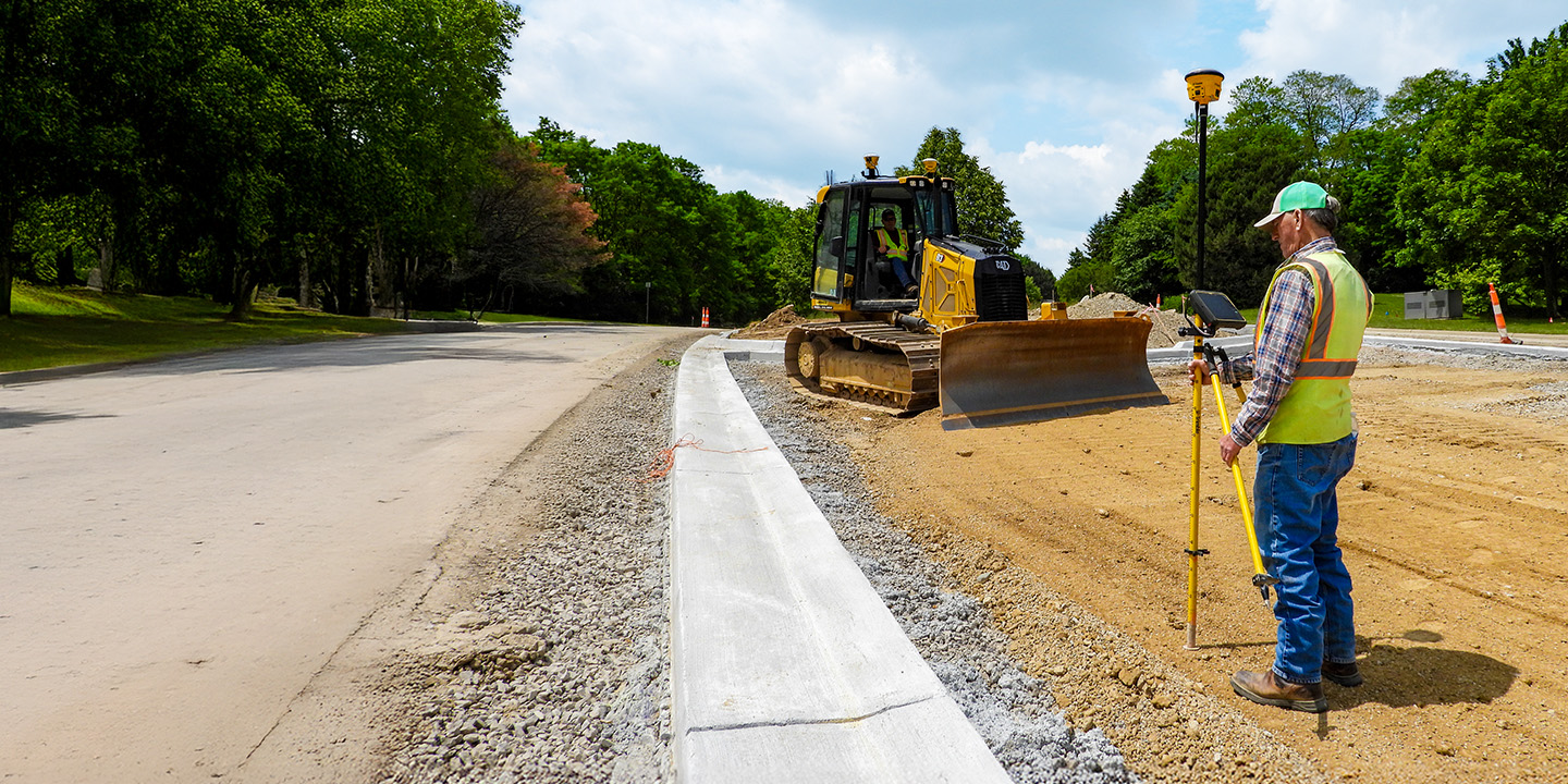 Construction crew utilizing their Trimble Works Plus subscription to ensure they have the latest Trimble technology on their paving project including the Trimble Earthworks grade control platform and Trimble Siteworks software