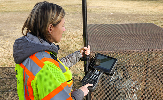 Surveyor using a Trimble TSC710 controller