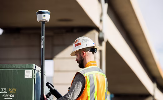 surveyor near a building