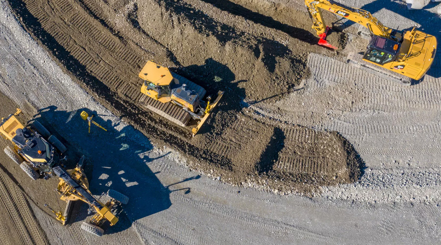 Heavy machines moving soil