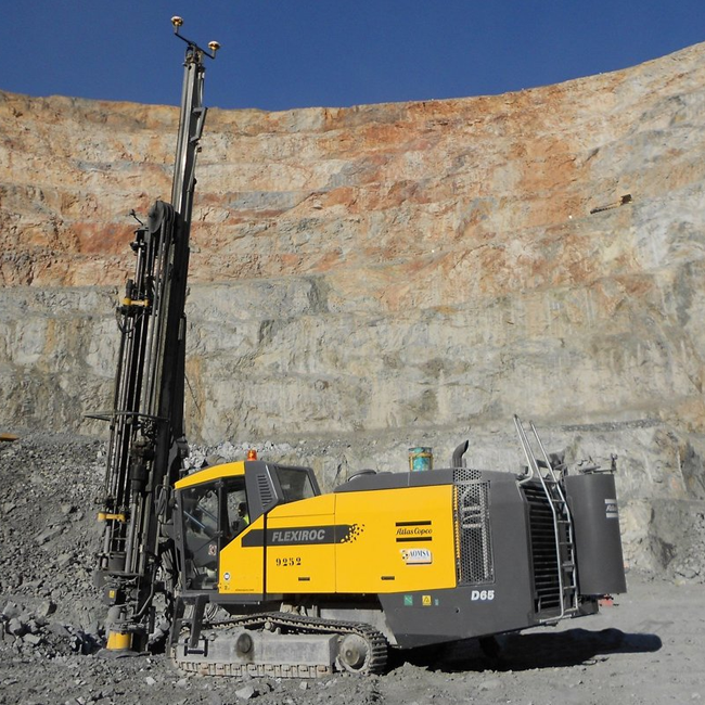 Large industrial machine working on a mining excavation site
