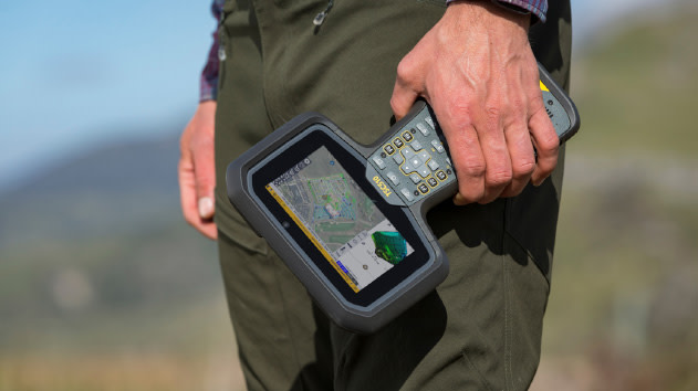 Worker holding a Trimble TSC510 data collector