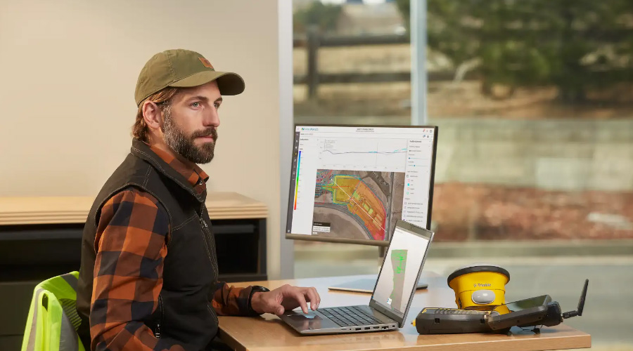 Worker in the office using Trimble Works software