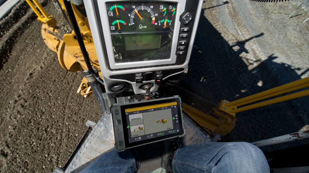 Worker operating an excavator