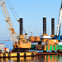 Successful in-harbor marine dredging operation with two cranes on a floating dredging platform