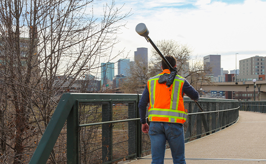Surveyor with a data collector mounted on a pole