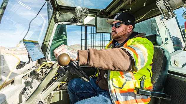 A crane operator load monitoring using the in-cab display with liftsense software