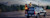 Man on the back of a truck adjusting an MX60 mobile mapping system on the roof of the truck