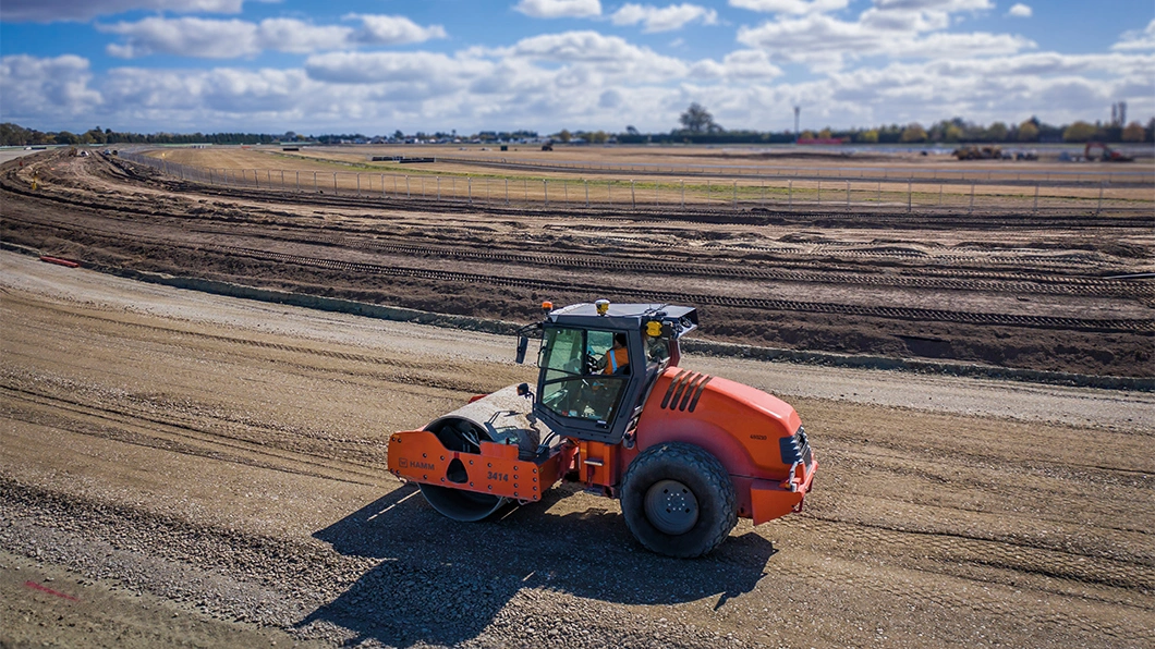 Soil Compactor with Trimble Earthworks Compaction Control compacting a racecourse