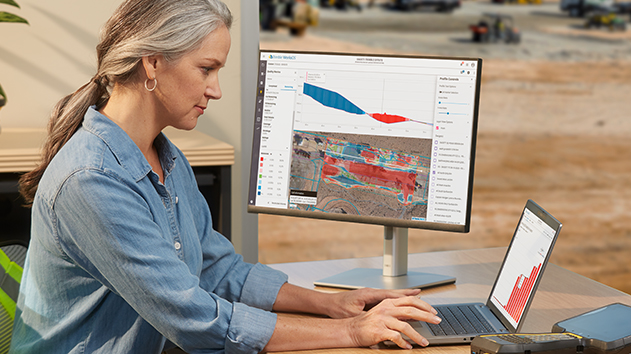 Site manager working in jobsite office connecting to the field using Trimble WorksManager software
