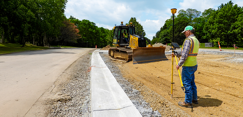 Construction crew utilizing their Trimble Works Plus subscription to ensure they have the latest Trimble technology on their paving project including the Trimble Earthworks grade control platform and Trimble Siteworks software