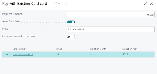 A graphic showing a payment using an existing credit card in Business Central.