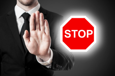 man holding hand in stop position