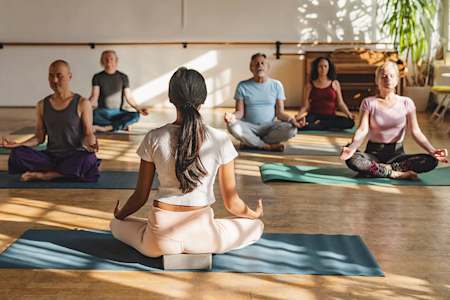 Patient taking a meditation class to help ease symptoms of lichen planus