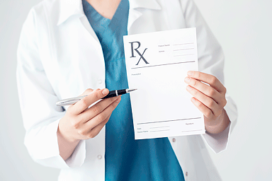 Doctor holding prescription pad