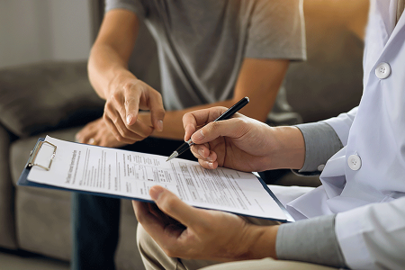 Dermatologist asking patient questions to find out if he can use a biosimilar