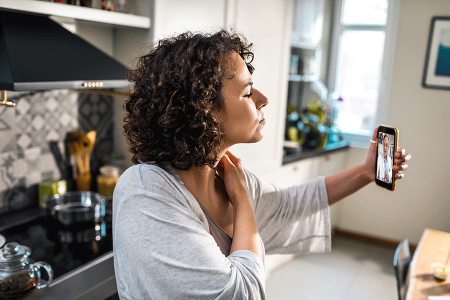 Patient video-chatting with dermatologist after using a biosimilar