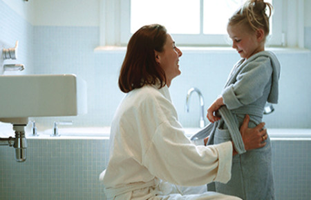 Adding colloidal oatmeal to your child’s bath can help relieve dry, itchy skin. mother and child bath