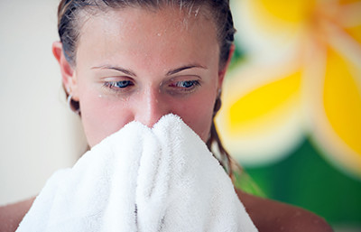 Woman toweling off face