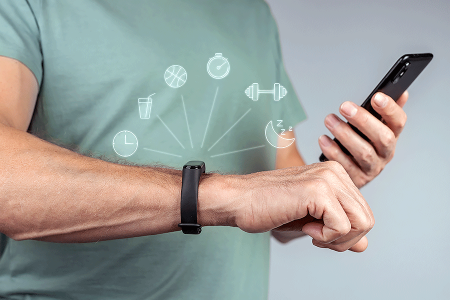 Man checking smartwatch to see steps taken