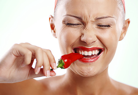 woman eating hot pepper