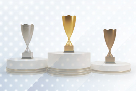 Three trophies, gold, silver, and bronze, to illustrate private payer wins. 