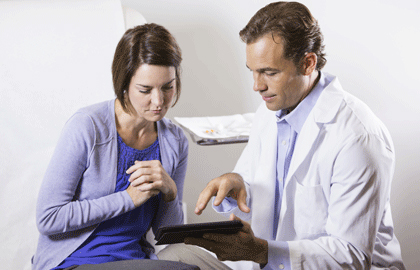 Physician consulting with female patient