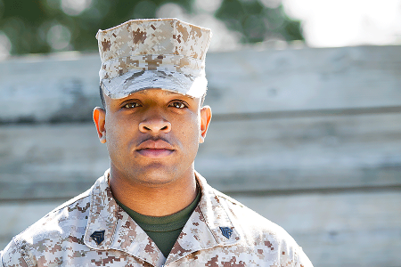 U.S. Marine has acne keloidalis nuchae under control, despite his closed-shaved haircut and need to wear a cap