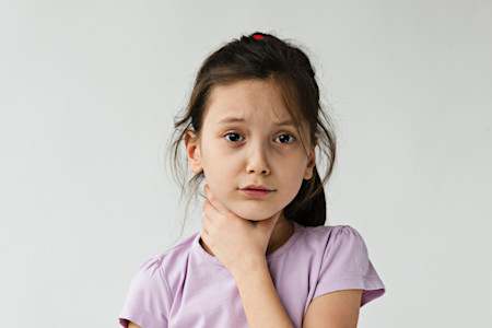 A young girl with eczema is having difficulty swallowing, which can be a sign that she also has eosinophilic esophagitis. 