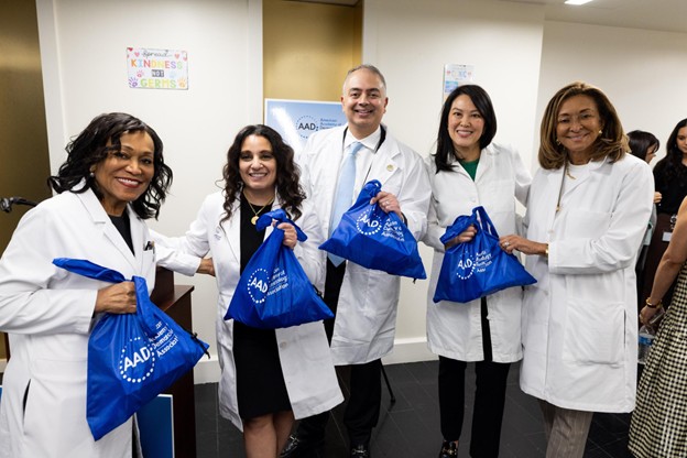 Left to right: Pearl Grimes, MD, FAAD, Mona Gohara, MD, FAAD, Seemal R. Desai, MD, FAAD, Ivy Lee, MD, FAAD, and Susan C. Taylor, MD, FAAD. They distributed bags of donated skin care supplies to temporary residents of the Mayfair Hotel. 