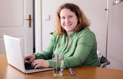 Happy woman at laptop