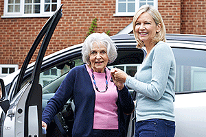 Daughter giving senior mother a ride to doctor appointment