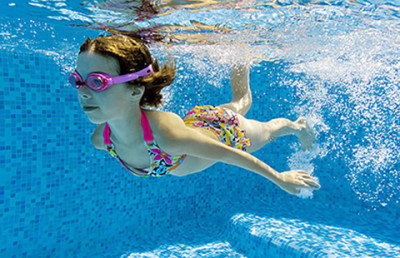 child swimming. Pool chemicals can dry the skin. 